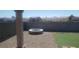 Backyard featuring a rock area, a fire pit, and artificial grass at 857 Lantham Pl, Las Vegas, NV 89110