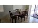 The dining room features a dark wooden table and tile flooring at 857 Lantham Pl, Las Vegas, NV 89110