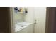 Laundry room featuring a white washer and dryer, shelving, and a white door at 857 Lantham Pl, Las Vegas, NV 89110