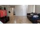 Spacious living room with tile floors and neutral walls at 857 Lantham Pl, Las Vegas, NV 89110