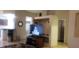 Open living room with modern features, including a breakfast bar, tiled floors, and neutral walls at 857 Lantham Pl, Las Vegas, NV 89110