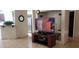 A modern living room features a television, stylish furniture, and tile flooring at 857 Lantham Pl, Las Vegas, NV 89110
