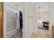 Bathroom with shower-tub combo, white tile, and neutral walls, accessible from an adjoining bedroom at 8838 Spanish Mountain Dr, Las Vegas, NV 89148