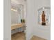Powder room with a decorative mirror and sink at 8838 Spanish Mountain Dr, Las Vegas, NV 89148