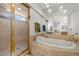 Bathroom with a soaking tub and separate shower at 8838 Spanish Mountain Dr, Las Vegas, NV 89148