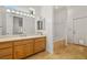 Bright bathroom featuring a marble countertop, full mirror, and tiled tub and shower at 8838 Spanish Mountain Dr, Las Vegas, NV 89148
