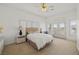 Bedroom with shutters, french doors and a plush bed create a serene retreat in this beautiful home at 8838 Spanish Mountain Dr, Las Vegas, NV 89148