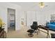 Spacious bedroom with an open layout, adjoining bathroom and closet and neutral walls and carpet at 8838 Spanish Mountain Dr, Las Vegas, NV 89148