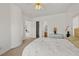 Bright and airy bedroom features large windows, neutral tones, and access to both a bathroom and closet at 8838 Spanish Mountain Dr, Las Vegas, NV 89148
