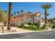 Stunning home with a red tile roof, manicured landscaping, and a circular driveway at 8838 Spanish Mountain Dr, Las Vegas, NV 89148