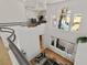 High angle view of the open concept layout and large foyer with large windows at 8838 Spanish Mountain Dr, Las Vegas, NV 89148