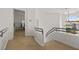 Open hallway with unique railing, leading to staircase and upper level living spaces at 8838 Spanish Mountain Dr, Las Vegas, NV 89148