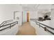Hallway leading to upper level with a view of the downstairs Gathering room at 8838 Spanish Mountain Dr, Las Vegas, NV 89148