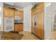 Bright kitchen featuring matching refrigerator and cabinetry with an attached dining space at 8838 Spanish Mountain Dr, Las Vegas, NV 89148