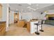 Spacious kitchen with an island, breakfast bar, and wood cabinetry at 8838 Spanish Mountain Dr, Las Vegas, NV 89148