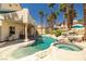Backyard pool with waterfall features and lush landscaping offers a serene escape at 8838 Spanish Mountain Dr, Las Vegas, NV 89148