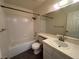 A bright bathroom features a tiled shower and countertop with ample vanity storage at 8940 Clairton Ct, Las Vegas, NV 89117