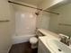 A bright bathroom features a tiled shower and countertop with ample vanity storage at 8940 Clairton Ct, Las Vegas, NV 89117