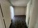 Empty bedroom with tile floors, sliding door, and a large closet at 8940 Clairton Ct, Las Vegas, NV 89117