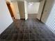 The bedroom boasts tile flooring, vertical blinds, and neutral paint at 8940 Clairton Ct, Las Vegas, NV 89117