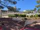 A condominium building with well-manicured landscaping at 8940 Clairton Ct, Las Vegas, NV 89117