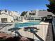Pool area with jacuzzi and building at 8940 Clairton Ct, Las Vegas, NV 89117