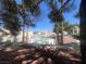 Community pool area with lush greenery and landscaping at 8940 Clairton Ct, Las Vegas, NV 89117