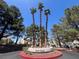 Community entrance features mature trees and landscaping at 8940 Clairton Ct, Las Vegas, NV 89117