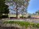 Well-maintained property featuring mature landscaping and charming walkway at 8940 Clairton Ct, Las Vegas, NV 89117
