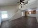 Open-concept floor plan featuring tile flooring, staircase, and views to kitchen area at 8940 Clairton Ct, Las Vegas, NV 89117