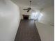 Living room with fireplace, access to the outside, and an open view from the loft at 8940 Clairton Ct, Las Vegas, NV 89117
