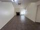 Bright living room with tile floors, fireplace, ceiling fan and staircase to the second floor at 8940 Clairton Ct, Las Vegas, NV 89117