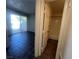 View from the hallway shows tile flooring and sliding doors to the back yard at 8940 Clairton Ct, Las Vegas, NV 89117
