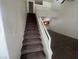 Carpeted staircase leading to the second floor, located off the living room at 8940 Clairton Ct, Las Vegas, NV 89117