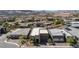 Wide aerial shot of a desert community, highlighting modern home with neutral colors and drought-resistant landscaping at 9 Reverie Heights Ave, Henderson, NV 89011