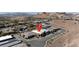 An aerial view of a modern home with desert landscaping, highlighted by a pin in a mountain community at 9 Reverie Heights Ave, Henderson, NV 89011