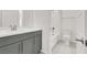 Clean bathroom with a gray vanity, modern fixtures, and a shower-tub combo for a relaxing bathing experience at 9 Reverie Heights Ave, Henderson, NV 89011