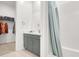 Stylish bathroom featuring a walk-in closet, modern vanity, and a shower-tub combo for convenience at 9 Reverie Heights Ave, Henderson, NV 89011