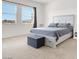 Inviting bedroom showcases a neutral color scheme, cozy carpet, and natural light from the windows at 9 Reverie Heights Ave, Henderson, NV 89011
