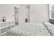 Bright bedroom showcasing a white shelf, soft carpet, and a neutral color scheme for a relaxing atmosphere at 9 Reverie Heights Ave, Henderson, NV 89011