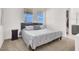 Comfortable bedroom featuring a neutral color scheme, plush carpeting, and plenty of natural light at 9 Reverie Heights Ave, Henderson, NV 89011