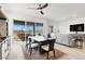 Elegant dining area showcases stylish decor, a seamless flow to the backyard, and bright natural light at 9 Reverie Heights Ave, Henderson, NV 89011
