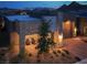Stylish home showcasing stone accents, a two-car garage, and a covered patio area at 9 Reverie Heights Ave, Henderson, NV 89011
