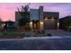 Contemporary home with a stone facade, neutral stucco, two-car garage, and desert landscaping at 9 Reverie Heights Ave, Henderson, NV 89011