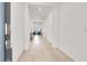 Bright hallway featuring recessed lighting and views into an open-concept living space at 9 Reverie Heights Ave, Henderson, NV 89011