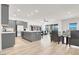 Open floor plan offers modern kitchen, dining, and living area, perfect for entertaining at 9 Reverie Heights Ave, Henderson, NV 89011