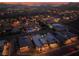 Scenic aerial night view of homes with lit pools and city lights in a luxury desert community at 9 Reverie Heights Ave, Henderson, NV 89011