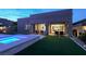 Outdoor living area with a sparkling pool, spa, and comfortable patio seating at 9 Reverie Heights Ave, Henderson, NV 89011