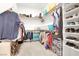Bright walk-in closet featuring built-in shelves and ample storage space for clothes and accessories at 9 Reverie Heights Ave, Henderson, NV 89011