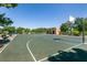 Outdoor basketball court with backboard and building nearby, surrounded by trees at 9001 Picket Fence Ave, Las Vegas, NV 89143